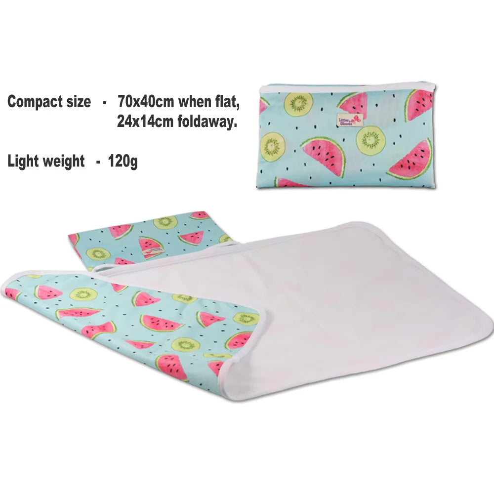 Portable waterproof baby changing mat folded for travel | Baby lying on foldable washable changing mat | Compact baby play mat with waterproof surface | Lightweight diaper changing mat for on-the-go use | Soft and hygienic baby changing pad for daily use | Travel baby mat with snap closure and easy fold | Machine washable baby changing mat on wooden floor | Modern baby play mat for indoor and outdoor use | Foldable diaper changing pad inside diaper bag | Waterproof changing mat for babies in neutral design