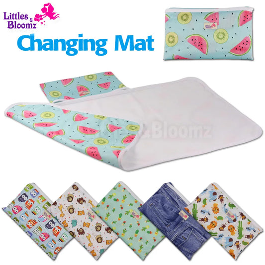 Portable waterproof baby changing mat folded for travel | Baby lying on foldable washable changing mat | Compact baby play mat with waterproof surface | Lightweight diaper changing mat for on-the-go use | Soft and hygienic baby changing pad for daily use | Travel baby mat with snap closure and easy fold | Machine washable baby changing mat on wooden floor | Modern baby play mat for indoor and outdoor use | Foldable diaper changing pad inside diaper bag | Waterproof changing mat for babies in neutral design